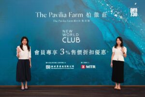 Two women in white tops pose with peace signs in front of a blue promotional backdrop showing The Pavilia Farm New World Club logos and Chinese text